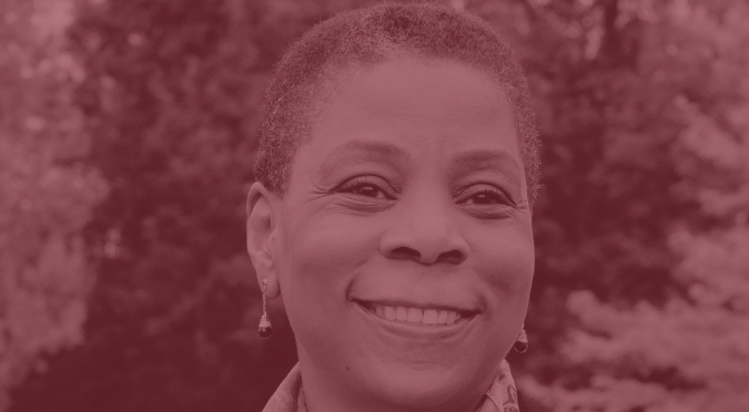 Photo of Ursula Burns smiling with a natural background