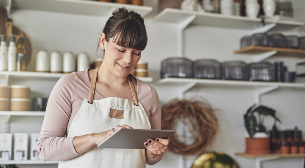 Entrepreneur in a kitchen looking at an iPad