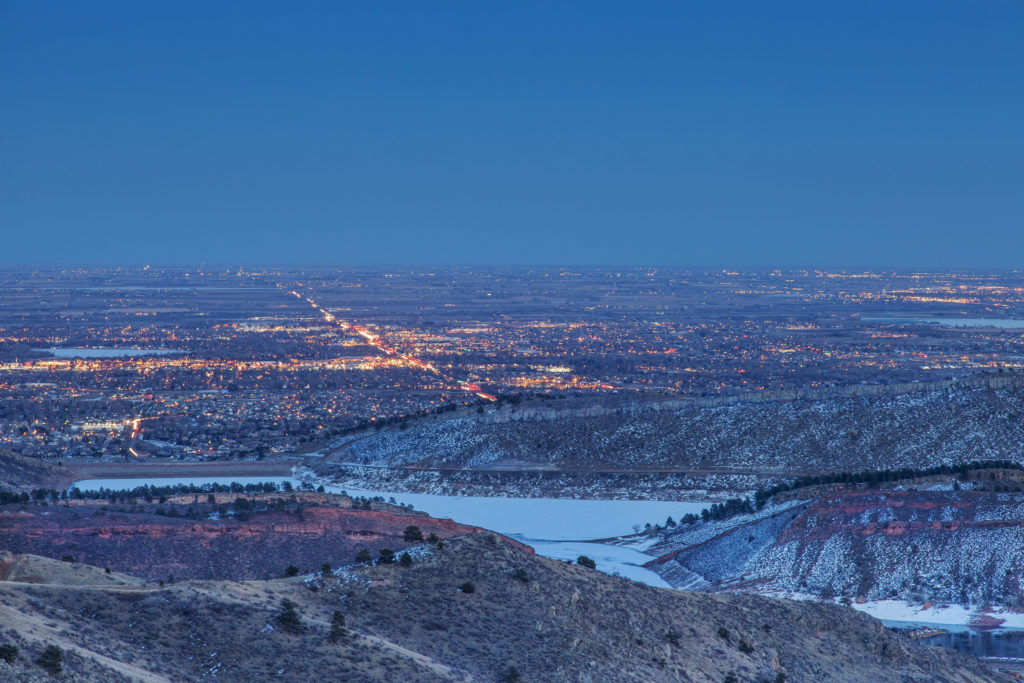 night view of Fort Collins in Colorado with foothills and Horsetooth Reservoir