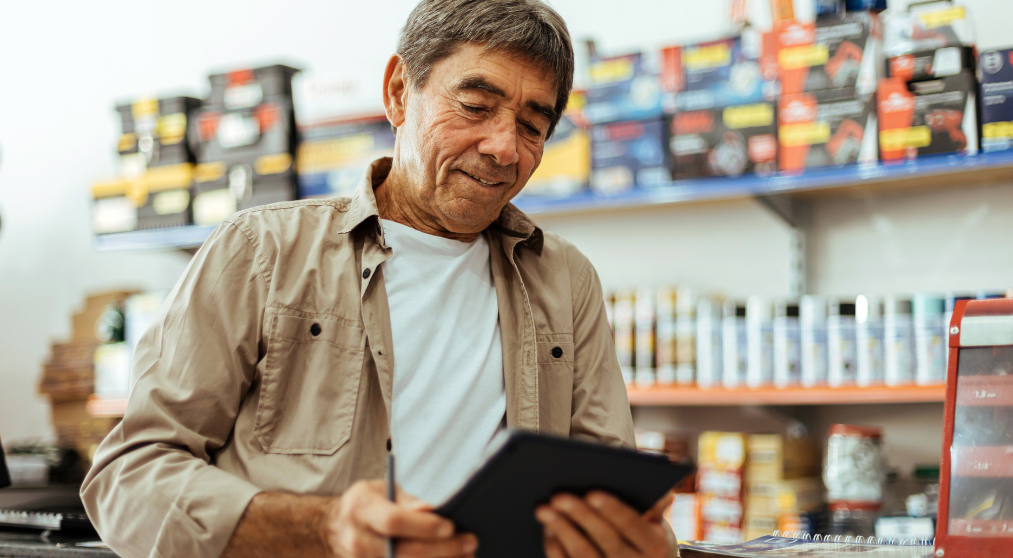 Business owner in his store reviewing business HELOC benefits