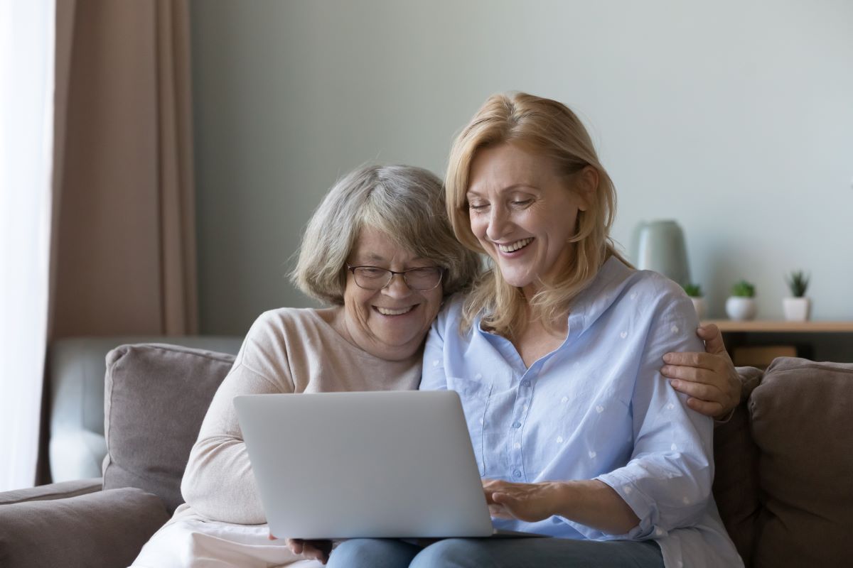 Cryptocurrency scams: Mother and adult daughter on couch