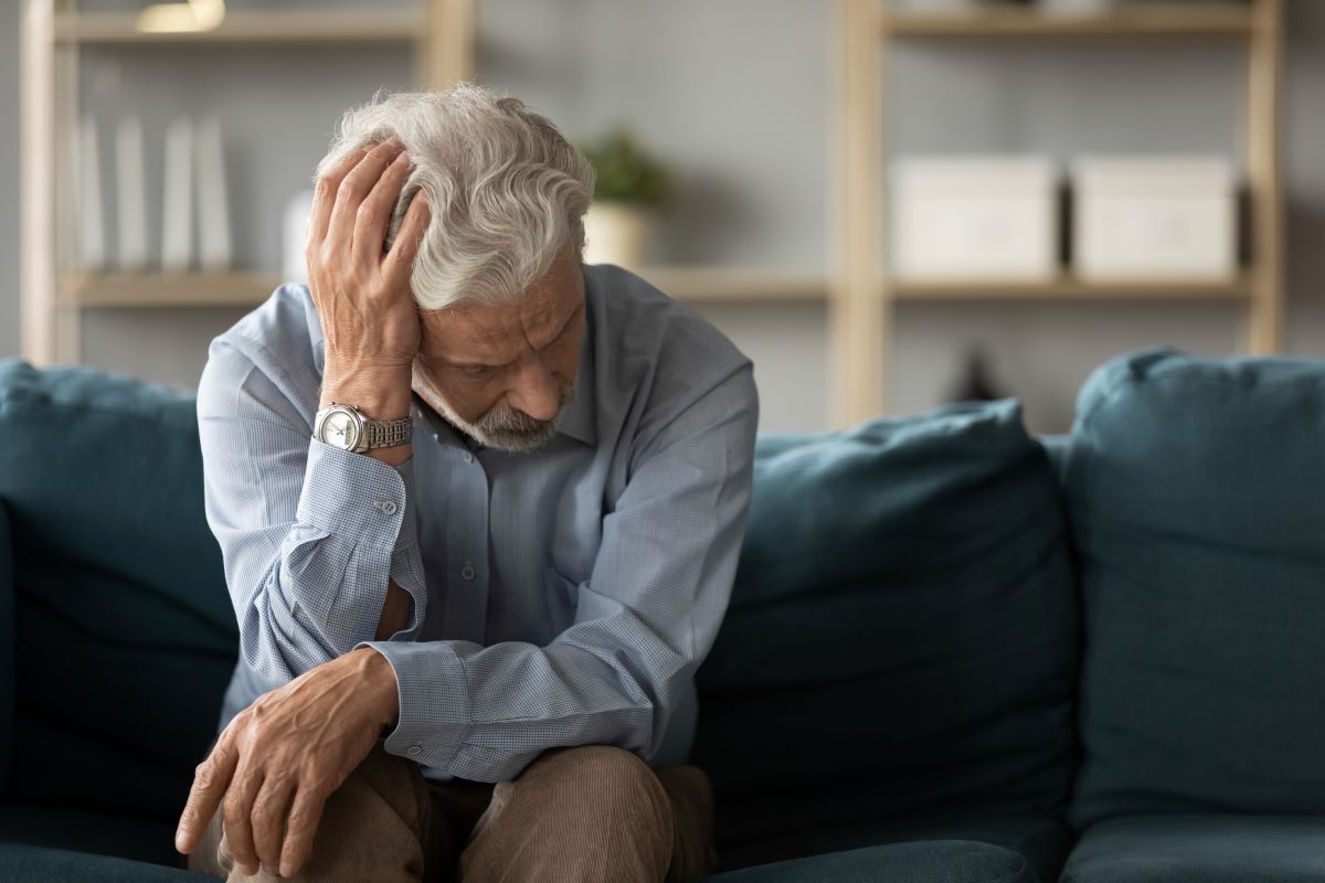Cryptocurrency scams: Senior man looking upset